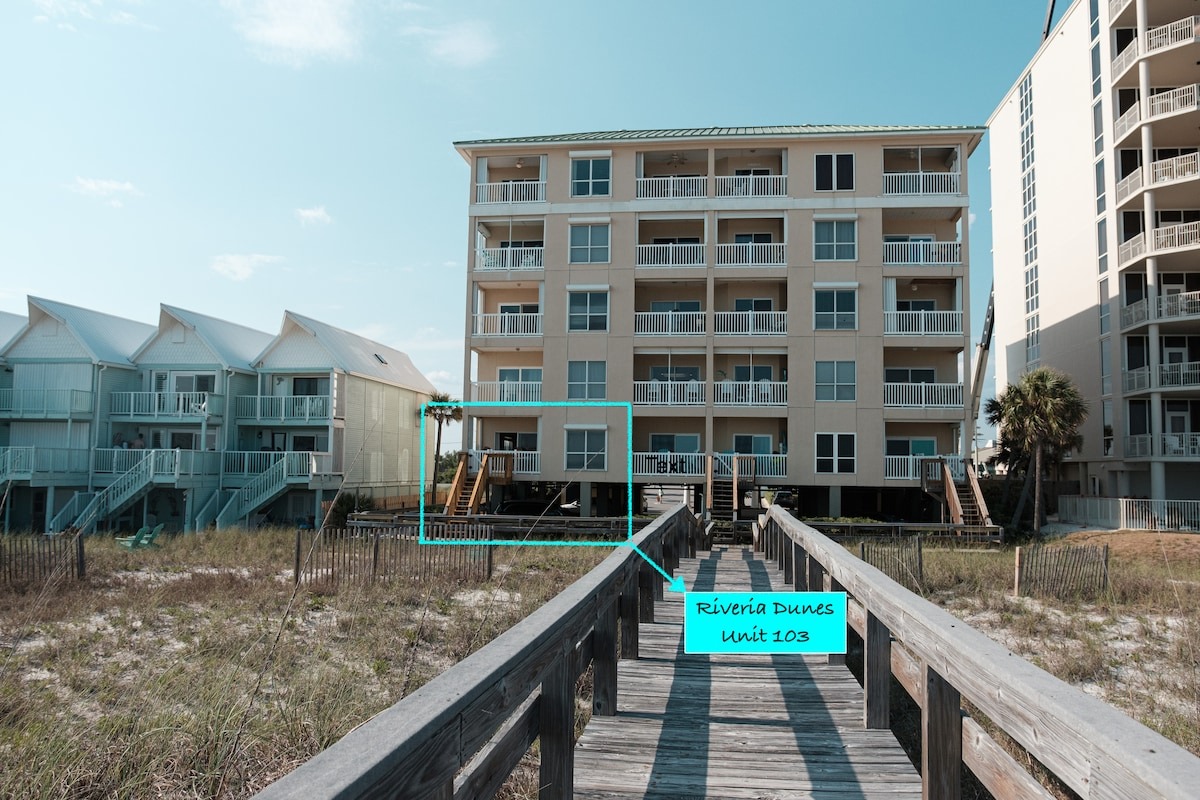 Exterior boardwalk context confirming beachfront access route.